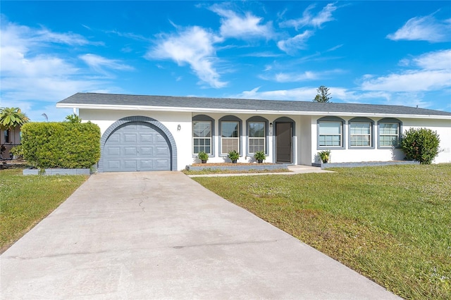20 Annapolis Ln, Rotonda West, FL 33947 - single story home with stucco siding, driveway, a front yard, and a garage