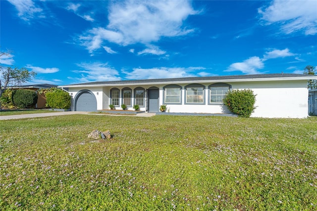 ranch-style house with a garage and a front yard