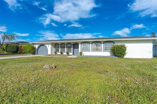 20 Annapolis Ln, Rotonda West, FL 33947 - ranch-style home featuring an attached garage, driveway, a front yard, and stucco siding