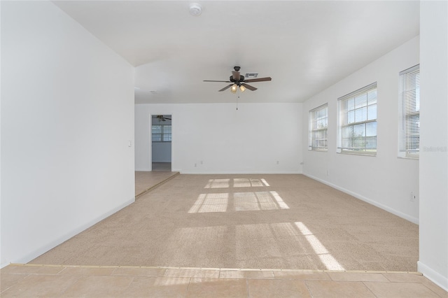 carpeted empty room with ceiling fan