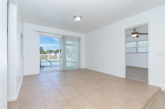 spare room featuring light tile patterned floors