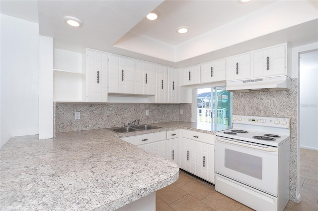 kitchen featuring white electric stove, a raised ceiling, sink, and white cabinets