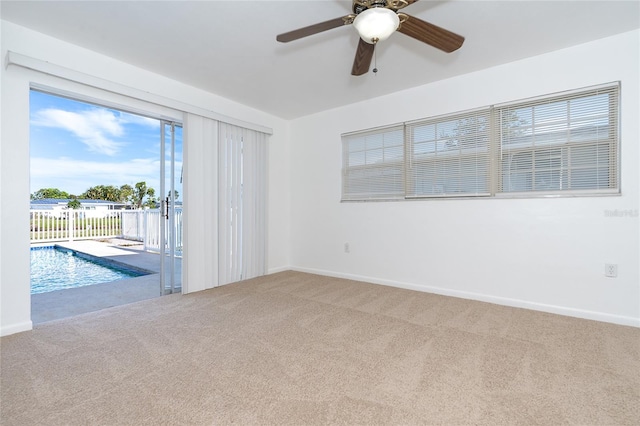 20 Annapolis Ln, Rotonda West, FL 33947 - carpeted empty room featuring baseboards and a ceiling fan