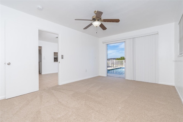 20 Annapolis Ln, Rotonda West, FL 33947 - carpeted empty room with baseboards and ceiling fan