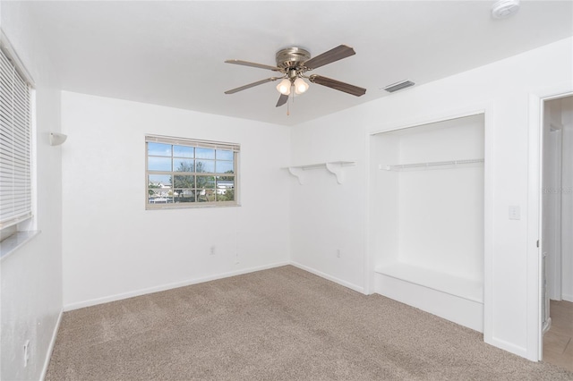 20 Annapolis Ln, Rotonda West, FL 33947 - unfurnished bedroom featuring carpet, a ceiling fan, baseboards, visible vents, and a closet