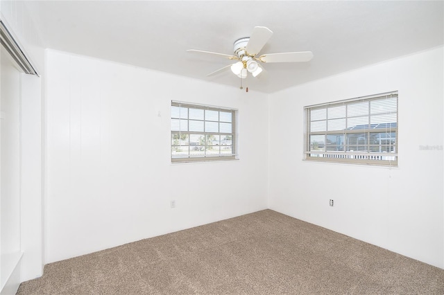 unfurnished room featuring carpet and ceiling fan