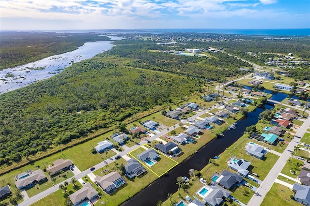 20 Annapolis Ln, Rotonda West, FL 33947 - bird's eye view with a water view and a wooded view