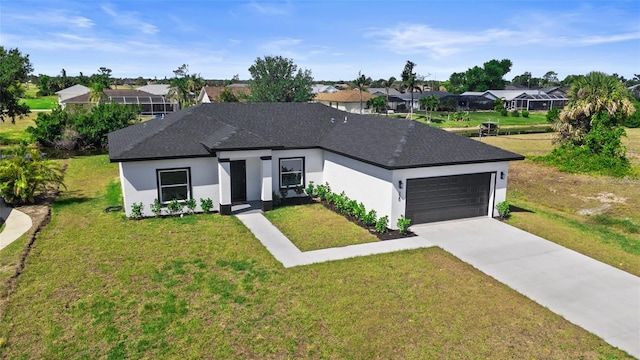 220 Mark Twain Ln, Rotonda West, FL 33947 - view of front of property featuring concrete driveway, an attached garage, a front yard, and stucco siding
