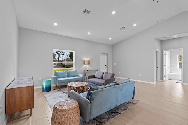 220 Mark Twain Ln, Rotonda West, FL 33947 - living room with baseboards, vaulted ceiling, recessed lighting, and visible vents