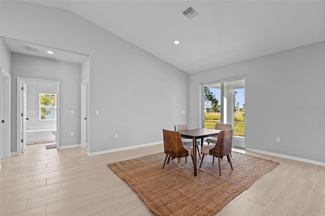 220 Mark Twain Ln, Rotonda West, FL 33947 - dining area with vaulted ceiling, a wealth of natural light, and visible vents