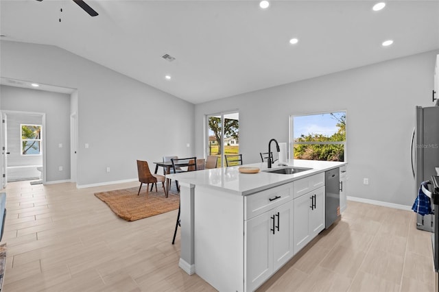 220 Mark Twain Ln, Rotonda West, FL 33947 - kitchen with ceiling fan, visible vents, appliances with stainless steel finishes, a sink, and lofted ceiling