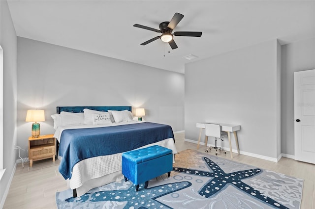 220 Mark Twain Ln, Rotonda West, FL 33947 - bedroom with baseboards, ceiling fan, and wood finished floors