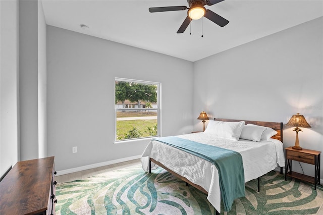 220 Mark Twain Ln, Rotonda West, FL 33947 - bedroom with baseboards, a ceiling fan, and wood finished floors