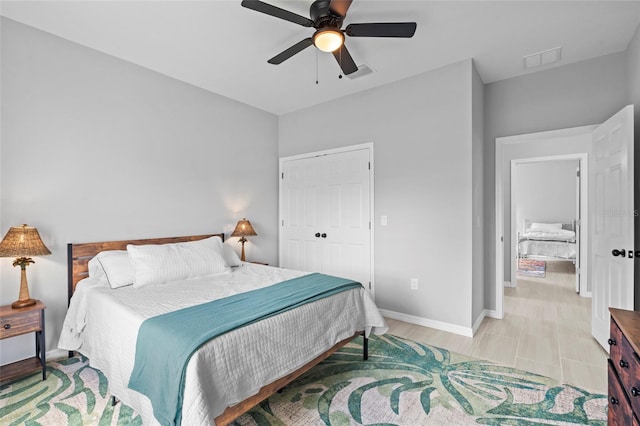 220 Mark Twain Ln, Rotonda West, FL 33947 - bedroom with visible vents, a ceiling fan, baseboards, and a closet