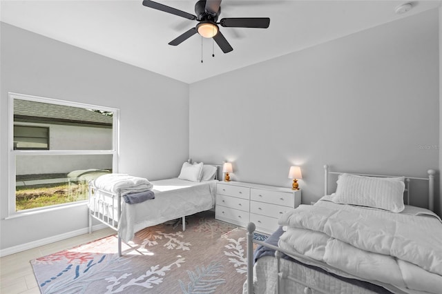 220 Mark Twain Ln, Rotonda West, FL 33947 - bedroom featuring baseboards and a ceiling fan