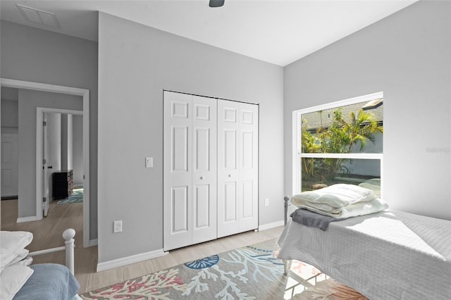 220 Mark Twain Ln, Rotonda West, FL 33947 - bedroom with visible vents, baseboards, a closet, and light wood-type flooring