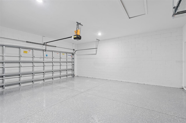220 Mark Twain Ln, Rotonda West, FL 33947 - garage with concrete block wall and a garage door opener