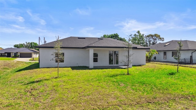 220 Mark Twain Ln, Rotonda West, FL 33947 - back of house featuring a shingled roof, stucco siding, and a yard