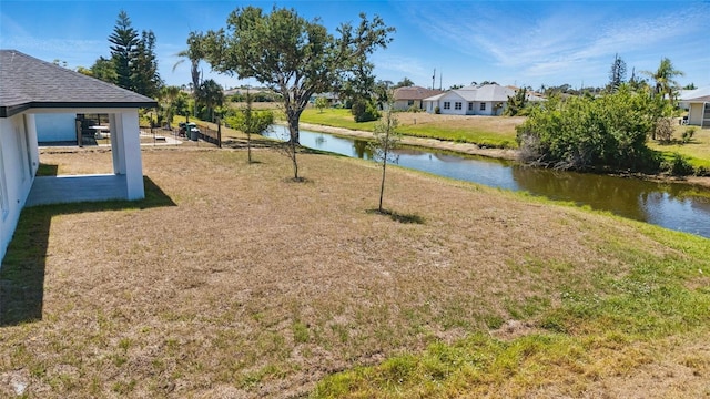 220 Mark Twain Ln, Rotonda West, FL 33947 - view of yard with a residential view and a water view