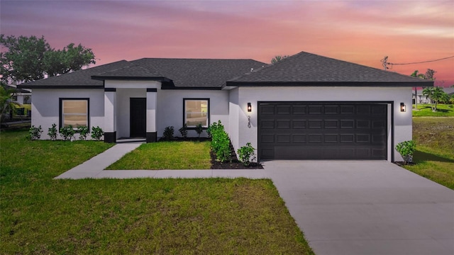 220 Mark Twain Ln, Rotonda West, FL 33947 - view of front of property with concrete driveway, stucco siding, a shingled roof, and a garage