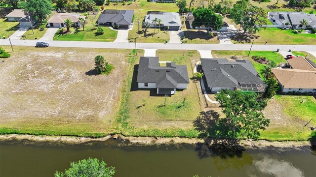 220 Mark Twain Ln, Rotonda West, FL 33947 - birds eye view of property featuring a water view and a residential view