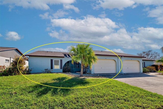 612 Deerwood Ave Unit 169, Englewood, FL 34223 - single story home featuring driveway, a front yard, an attached garage, and stucco siding