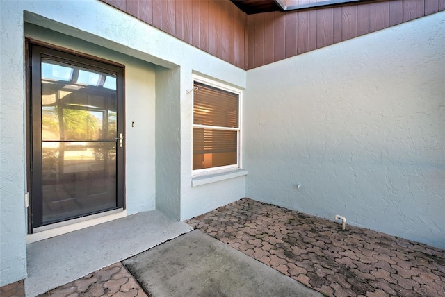 612 Deerwood Ave Unit 169, Englewood, FL 34223 - entrance to property featuring stucco siding and a patio area