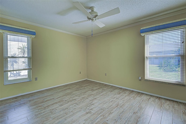 unfurnished room with crown molding, light hardwood / wood-style floors, and ceiling fan