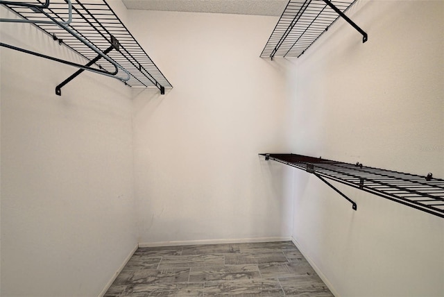 walk in closet featuring wood-type flooring