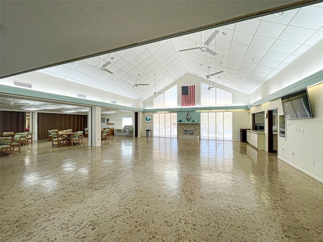 interior space with high vaulted ceiling and ceiling fan