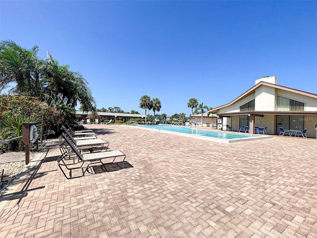 612 Deerwood Ave Unit 169, Englewood, FL 34223 - community pool with a patio area