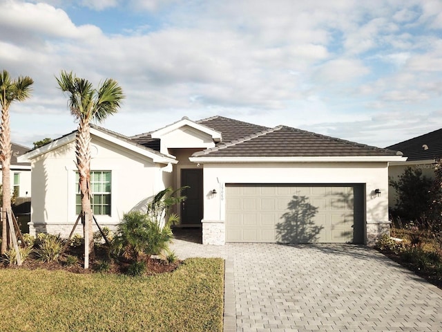 ranch-style home featuring a garage