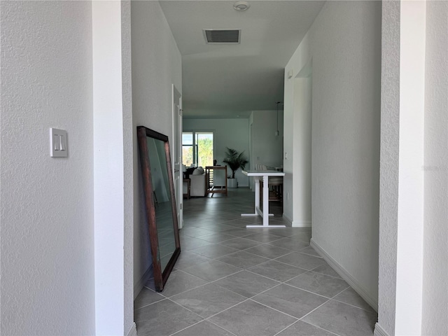 corridor featuring tile patterned flooring