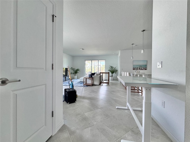 interior space with a textured ceiling