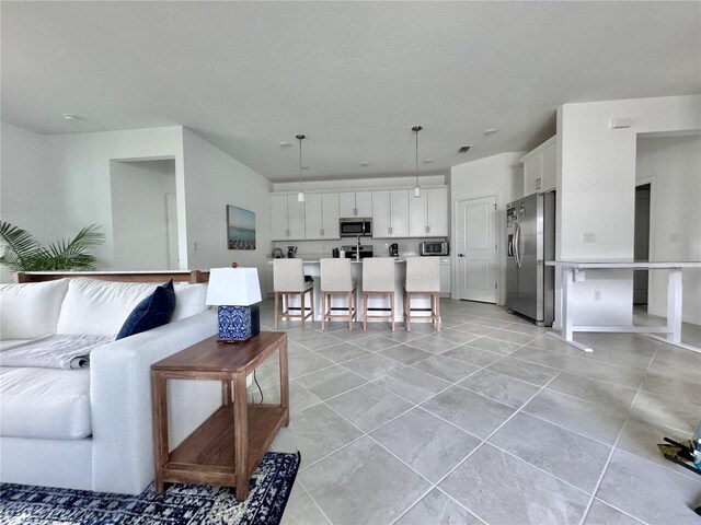 living room with light tile patterned floors