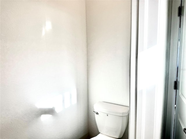 bathroom featuring toilet