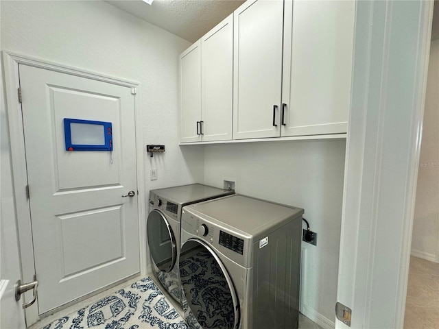 19060 Moscato Ct, Venice, FL 34293 - washroom with cabinet space, washing machine and clothes dryer, baseboards, and a textured ceiling