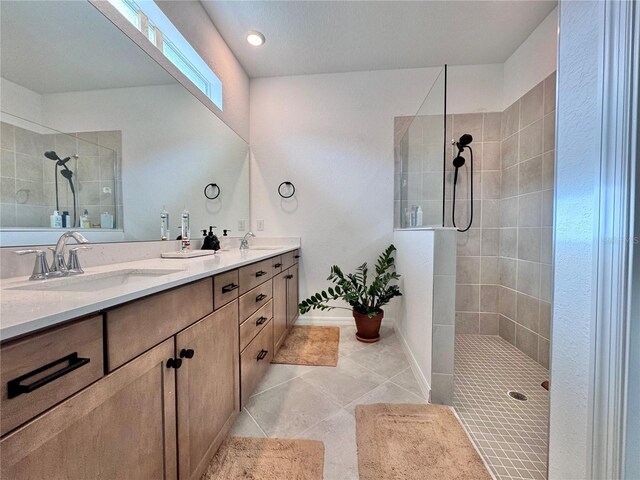 19060 Moscato Ct, Venice, FL 34293 - bathroom with a walk in shower, double vanity, tile patterned flooring, and baseboards