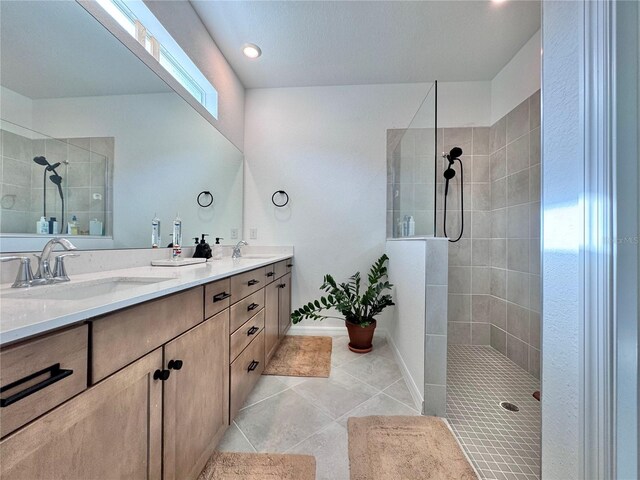 19060 Moscato Ct, Venice, FL 34293 - bathroom with walk in shower, double vanity, tile patterned flooring, and baseboards