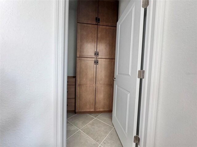 19060 Moscato Ct, Venice, FL 34293 - hallway with light tile patterned flooring