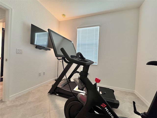 exercise area with light tile patterned flooring