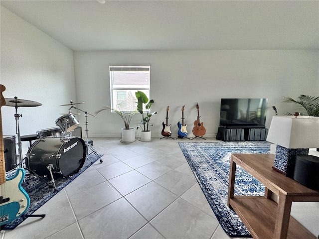19060 Moscato Ct, Venice, FL 34293 - exercise area with tile patterned floors and baseboards