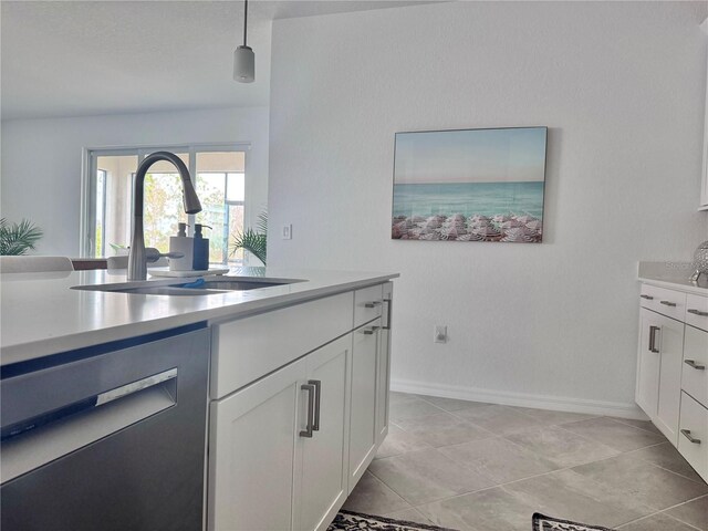19060 Moscato Ct, Venice, FL 34293 - kitchen featuring a sink, light countertops, white cabinets, and dishwasher