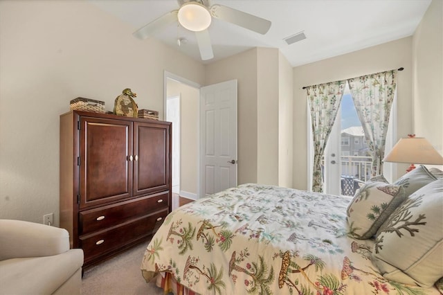 bedroom with access to outside, light colored carpet, and ceiling fan