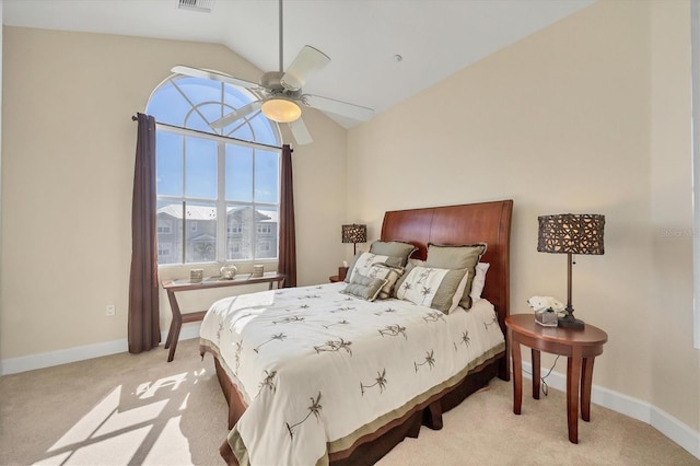 carpeted bedroom featuring vaulted ceiling and ceiling fan