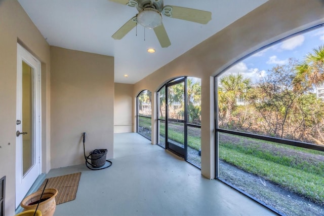 sunroom / solarium featuring ceiling fan