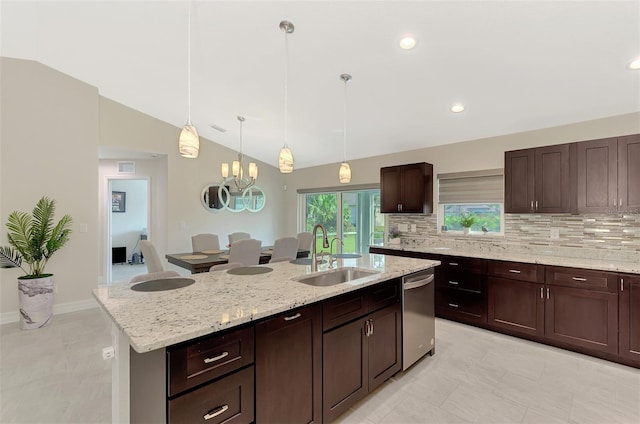 2775 Wyola Ave, North Port, FL 34286 - kitchen featuring stainless steel dishwasher, vaulted ceiling, backsplash, a sink, and a center island with sink