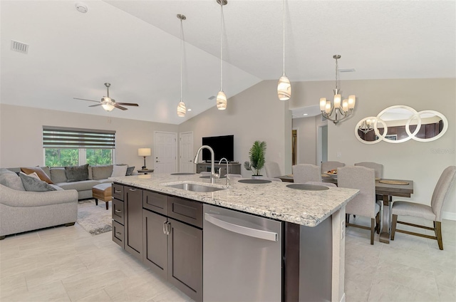 kitchen featuring lofted ceiling, dishwasher, pendant lighting, and sink