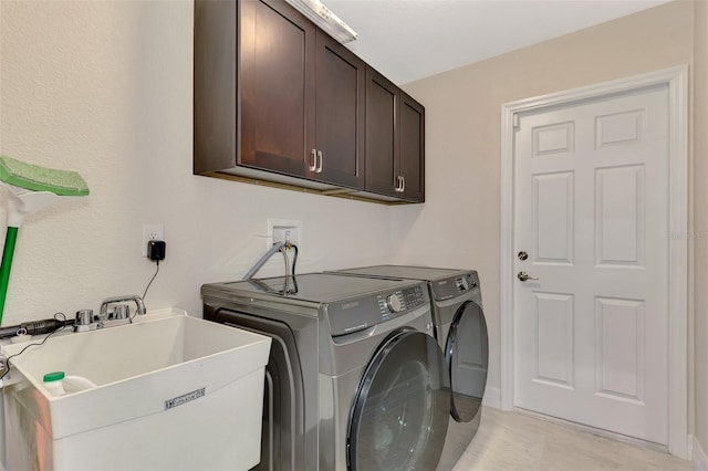 2775 Wyola Ave, North Port, FL 34286 - laundry area featuring independent washer and dryer, cabinet space, and a sink