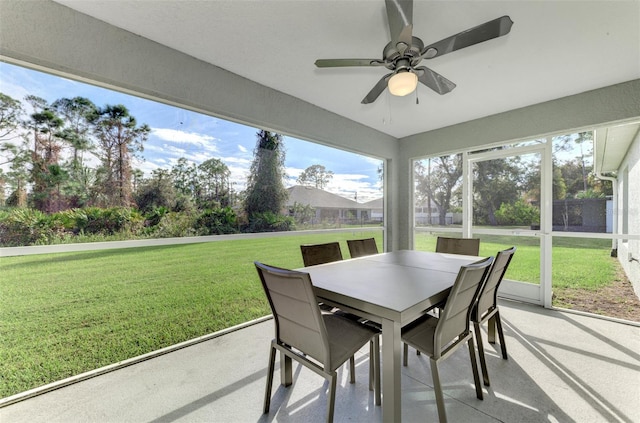 sunroom featuring ceiling fan